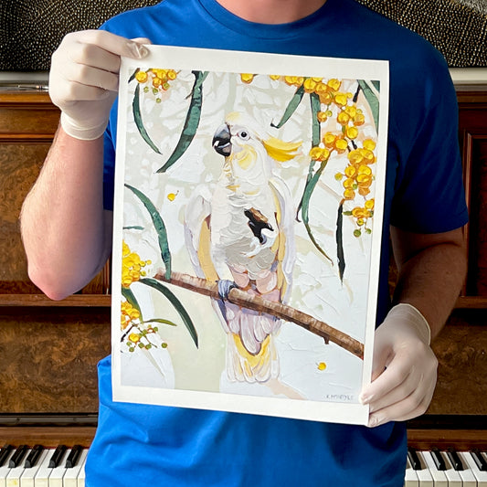 man holding Cockatoo art print by Australian artist, Kirsty McIntyre