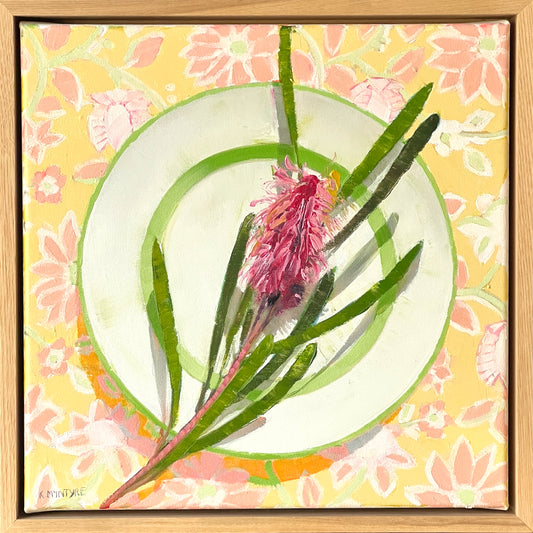 Framed artwork of a pink flower with green leaves on a yellow floral background
