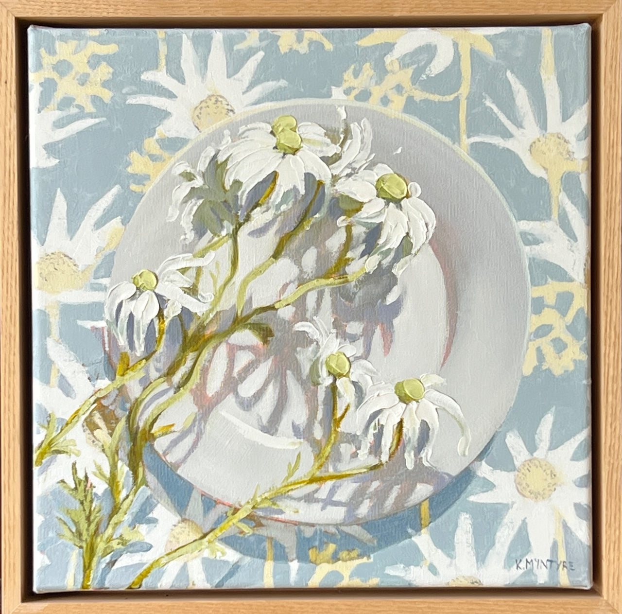 Framed artwork of a white dove with floral elements on a light blue background. Flannel flowers with Jocely Proust fabric original art by Kirsty Mcintyre, Australian artist