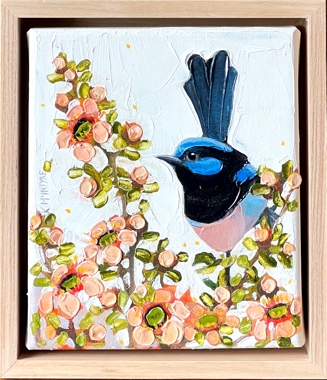 Framed artwork of a colorful bird perched on a branch with flowers- original artwork by australian artist, kirsty mcintyre featuring a superb blue wren on teatree