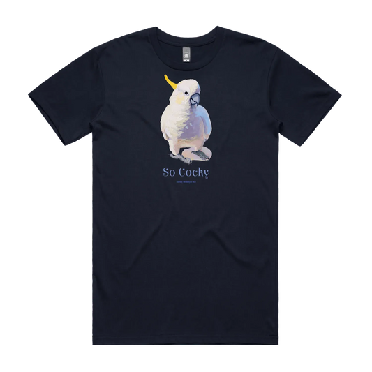 Navy front flat lay of a tshirt featuring an original Australian bird cockatoo graphic by popular bird artist, Kirsty McIntyre and the cheeky slogan "so cocky"