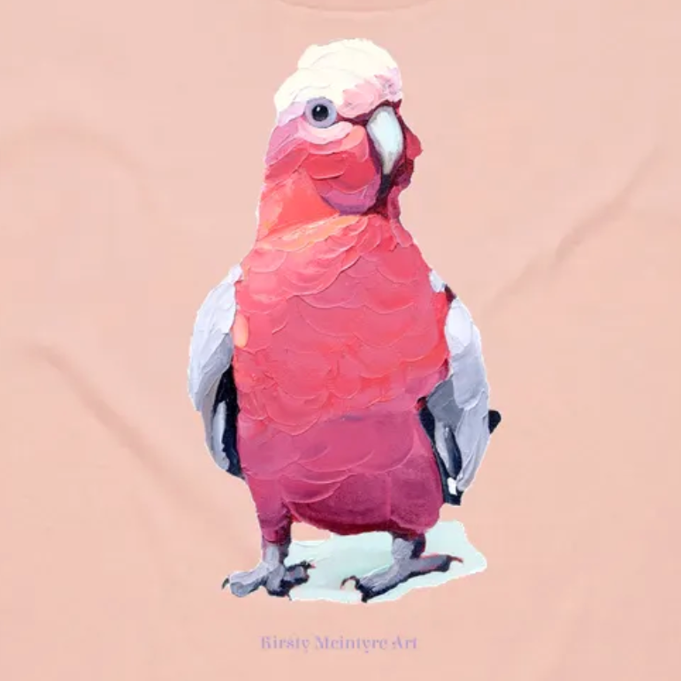 Artistic illustration of a pink galah parrot on a beige background- original tshirt design by Australian artist, Kirsty Mcintyre