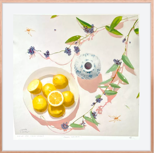 Framed giclee print artwork with lemons, a teacup, and floral elements on a light background